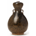 A MOTTLED BLACK GLAZED DOUBLE GOURD VASE