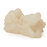 A CARVED WHITE JADE OX AND FIGURE GROUP