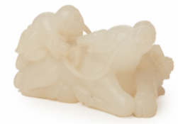 A CARVED WHITE JADE OX AND FIGURE GROUP