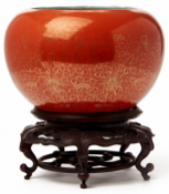 A CORAL GROUND GILT DECORATED SPHERICAL VASE