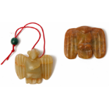 TWO SMALL HONGSHAN STYLE CARVED JADE PENDANTS