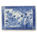 A BLUE AND WHITE RECTANGULAR PORCELAIN PLAQUE