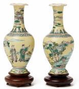 A PAIR OF SMALL YELLOW GROUND 'FAMILLE VERTE' BALUSTER VASES