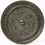 A CIRCULAR INSCRIBED BRONZE MIRROR