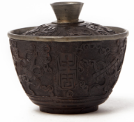 A CARVED COCONUT SHELL BOWL AND COVER
