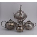 CHRISTOFLE, Service à thé en métal argenté comprenant une théière, un samovar, [...]