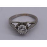 Bague en or gris serti d'un diamant demi-taille d'environ 0.75, PB. 4,9 gr (inclusion) -