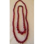 Two string of Cherry Amber/Bakelite Beads 17" L and 40 grams and 26" L and 40 grams.