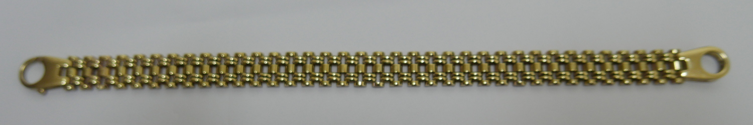 Gold Bracelet 21cm long 10mm wide and weighing 19.8 grams.