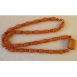 String of Egg Yolk/Butterscotch Beads -33" long - 78 grams - largest bead approx 30mm x 20mm.