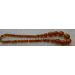String of Egg Yolk Amber Beads - 92 grams - string 25" (63cm) long largest bead approx 27x22mm.