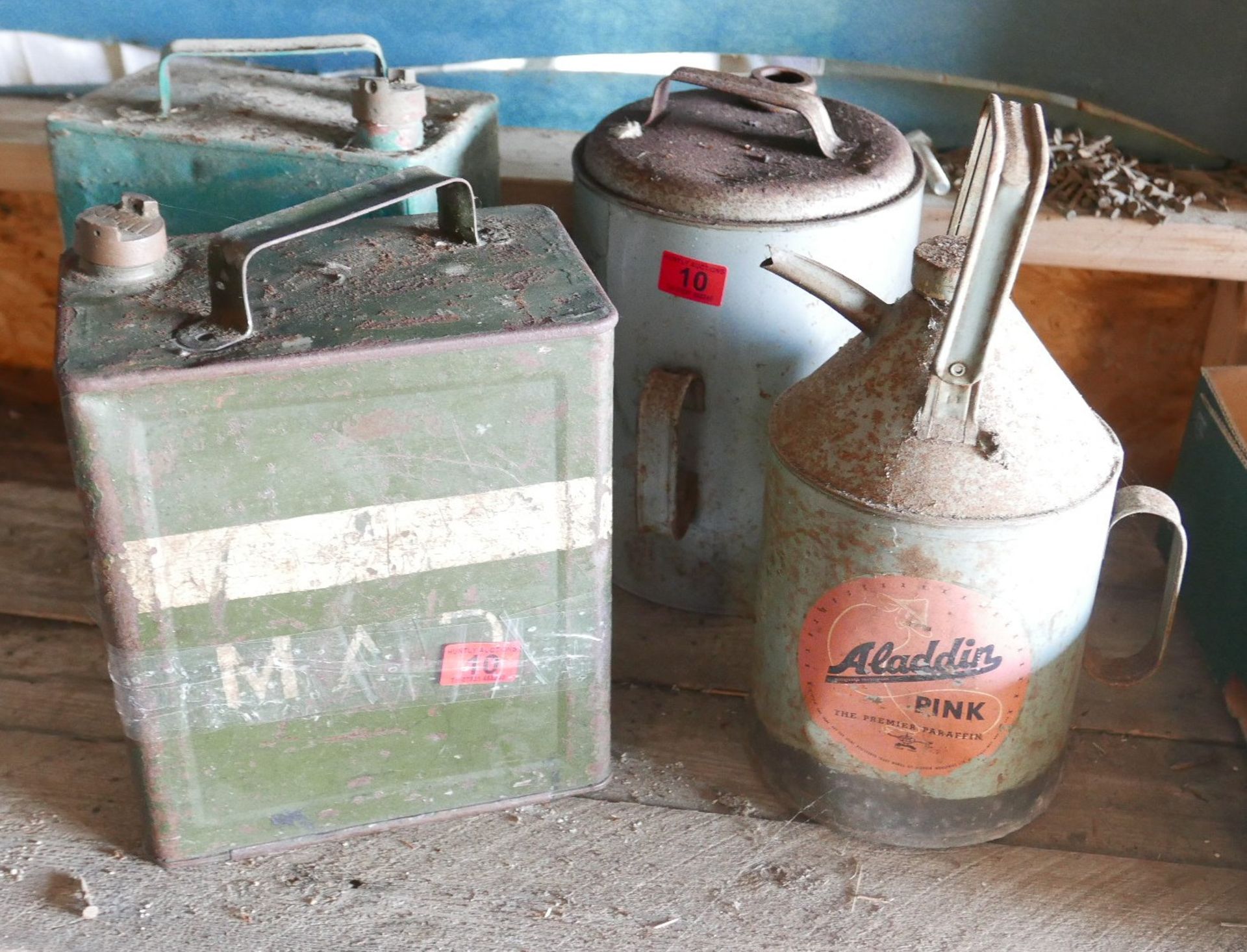 Lot of Paraffin and Petrol Tins.