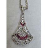 18ct white gold diamond and ruby fan shaped pendant with 18ct white gold 45cm cable chain.