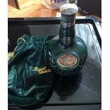 Decanter of Chivas Royal Salute 21 year old blended Whisky in green decanter with green cloth bag.