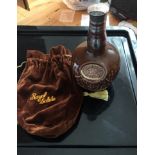 Decanter of Chivas Royal Salute 21 year old blended Whisky in brown decanter with brown cloth bag.