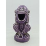 A novelty purple figure/match holder