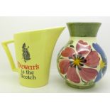 A Wade Dewar's water jug and a Siltone pottery hand painted vase