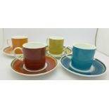 Four Susie Cooper coffee cans and saucers