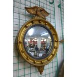 A Regency style gilt convex mirror