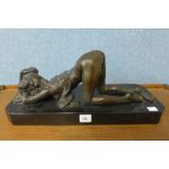 A bronze figure of an erotic female nude,
