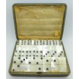 A 19th Century cased set of mother of pearl dominoes, the case marked Dreyfous,