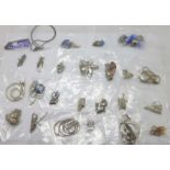 Twenty-five pendants and chains including silver