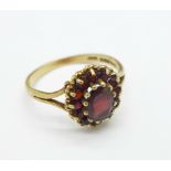A 9ct gold and garnet cluster ring, 2.