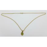 A 9ct gold and peridot pendant and chain, 5.