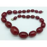 A sherry amber bead necklace, 76.