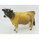 A Beswick Jersey Cow figure marked Ch.