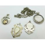 Three silver fobs and a pendant/locket on a white metal chain