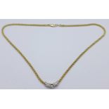 A 14ct gold and diamond three stone necklet, over 1 carat total diamond weight, 7.