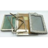 Four silver photograph frames,
