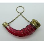 A 19th Century white metal mounted horn shaped cranberry glass scent bottle with inner stopper and