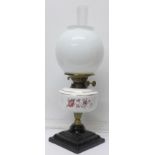 An oil lamp with ceramic base and oil chamber