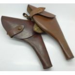Two officer's brown leather pistol holders
