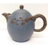A blue ceramic oriental teapot,