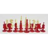 A chess set, (three replacement bases, two red,