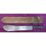 A WWII machete with leather scabbard,