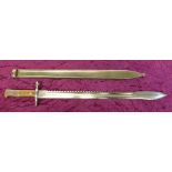 A saw back bayonet and scabbard,