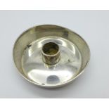 A silver Georg Jensen candle holder,