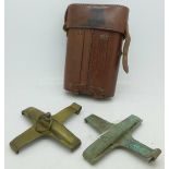 Two WWI British 18 pounder brass safety clips in a leather pouch