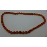 A string of butterscotch amber beads,