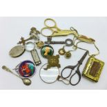 Two eye glasses, miniature Hohner harmonica, two enamelled coin pendants, cross, etc.