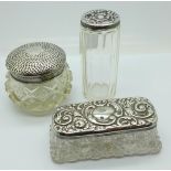 Two silver topped glass jars