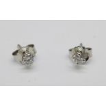 A pair of 18ct white gold diamond stud earrings, total diamond weight 0.