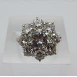 A nine stone diamond cluster ring, the centre stone approximately 1.