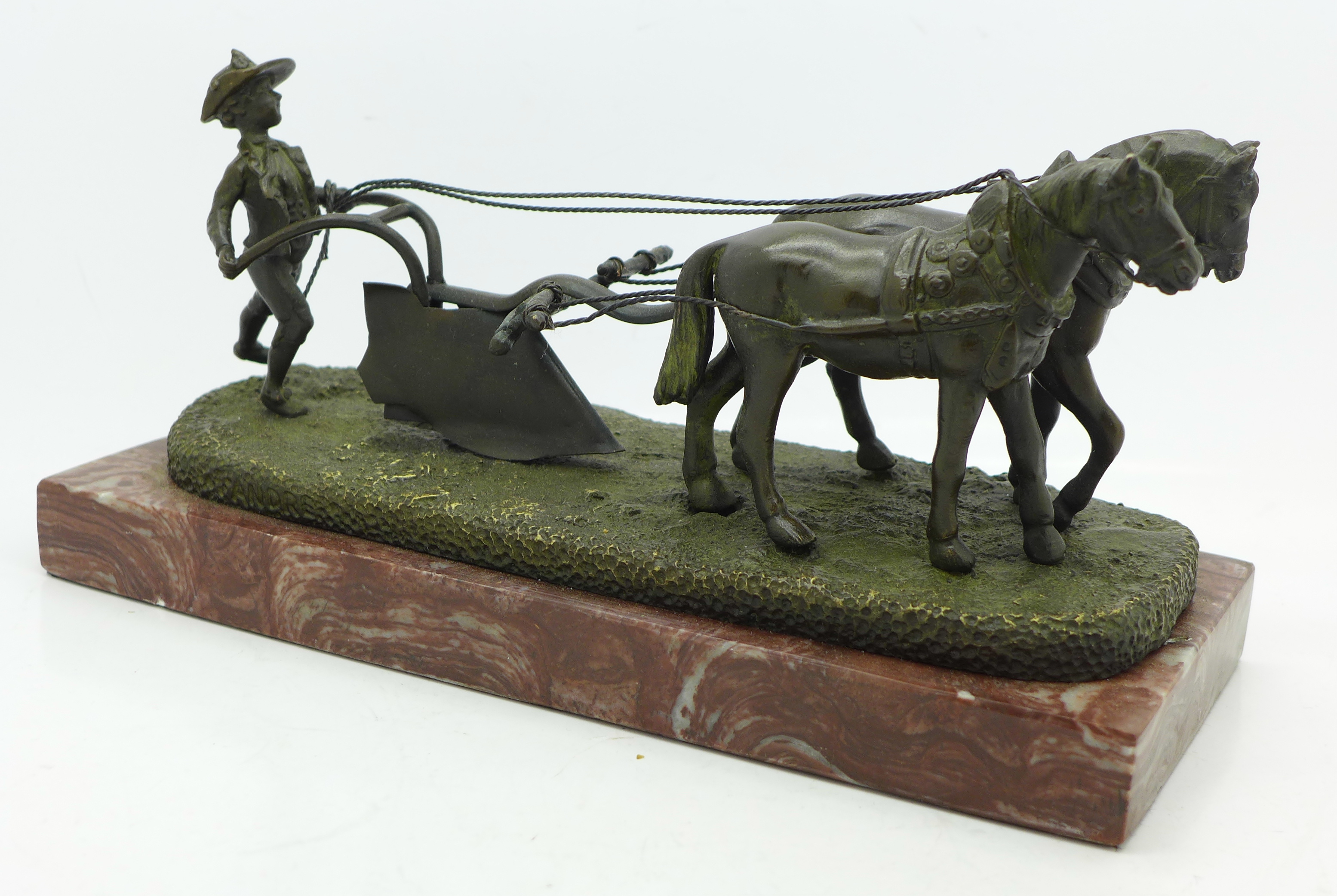 A continental bronze figure, two horses ploughing, on base, marked Andre, length of base 22.