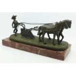 A continental bronze figure, two horses ploughing, on base, marked Andre, length of base 22.