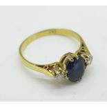 An 18ct yellow gold, diamond and sapphire three stone ring, 2.